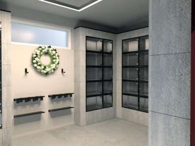 Moderné kolumbáriá s mramorovým obkladom a čiernym rámovaním, obklopené upravenou zeleňou, lavičkami a chodníkmi v upravených priestoroch cintorínov – ukážka riešení od spoločnosti MODU-AL.